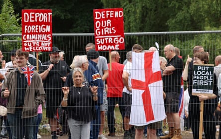 They hold signs saying Deport Foreign Criminals and Defend Our Girls