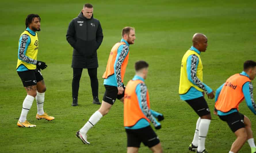 Wayne Rooney oversees training at Derby this month. Players must arrive for training sessions in their kit as part of updated coronavirus protocols emailed to all clubs by the EFL.Photograph: Tim Goode/PA