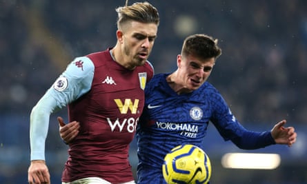 Jack Grealish of Aston Villa (left) and Mason Mount of Chelsea battle for the ball.