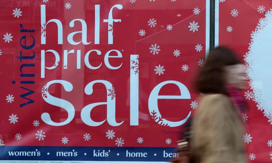 Christmas shopping  sale sign in the window of Debenhams