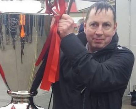 Stephen Crean lifting a cup pinch reddish ribbons