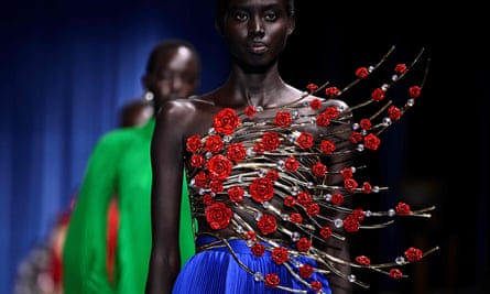 A model wearing a rosy Balmain creation