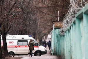 An ambulance car near No1 Infectious Diseases Clinical Hospital where a man with a suspected novel coronavirus infection is undergoing diagnostic testing