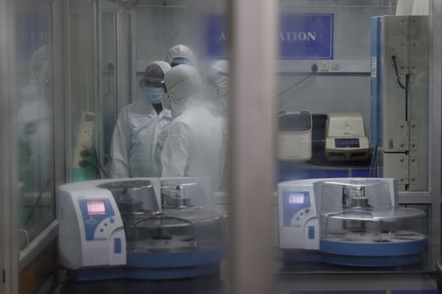 Health workers test for the monkey pox virus at a molecular laboratory set up by the Tamil Nadu Health Department in Chennai.