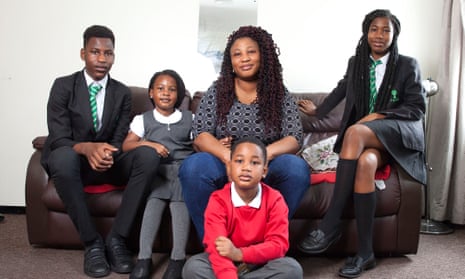 Joyce Tetteh, with her four children, had a bill of £465 for uniforms.