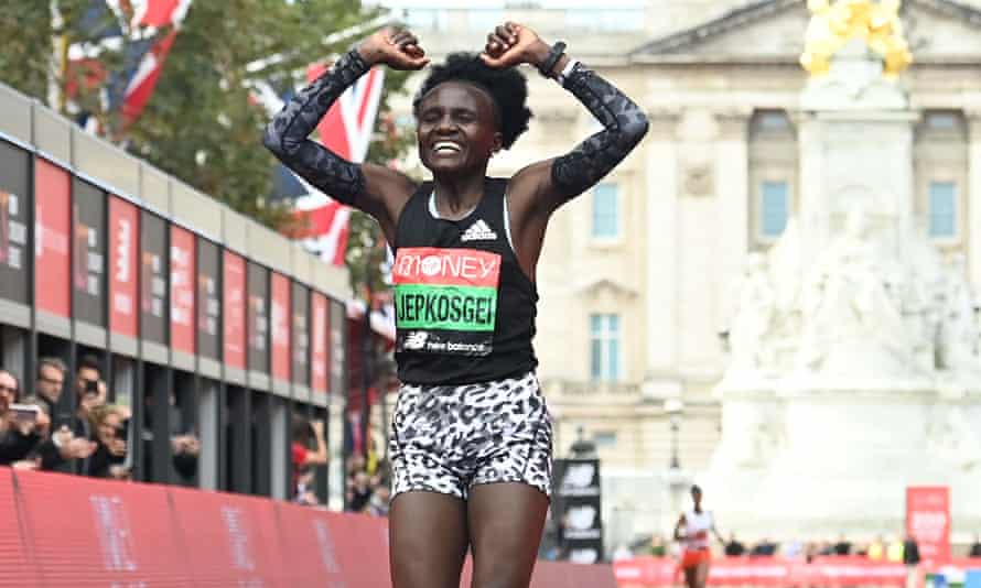 Kenya’s Joyciline Jepkosgei crosses the line to win the women’s race at the 2021 London marathon.