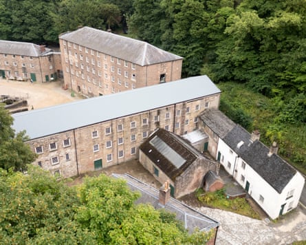 An aerial shot shows the cottages to the rear of Cromford mills