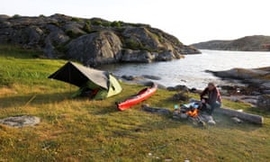 The author’s son, Niall, warms up at the campfire on Grimsholmen.