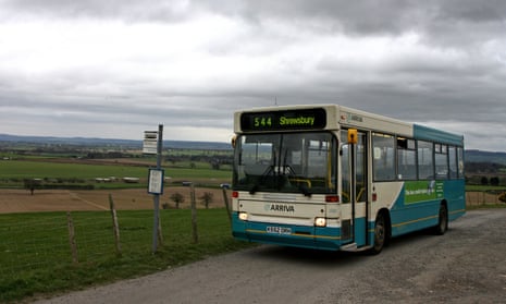 A bus travelling to Shrewsbury waits at a stop