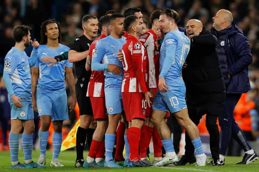 Pep Guardiola tries to hold back Jack Grealish as things get heated at the Etihad