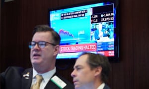 The floor of the New York Stock Exchange today, as trading was briefly halted