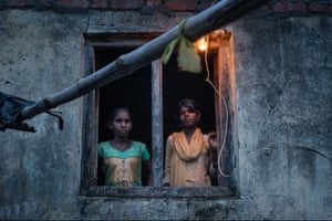 These two teenage girls, Kasari and Bodkha, will be travelling south to help their mother work on a sugar plantation. Four years ago, she had a hysterectomy and is in such poor health that her daughters have left school to help her. Beed district, Maharashtra, India