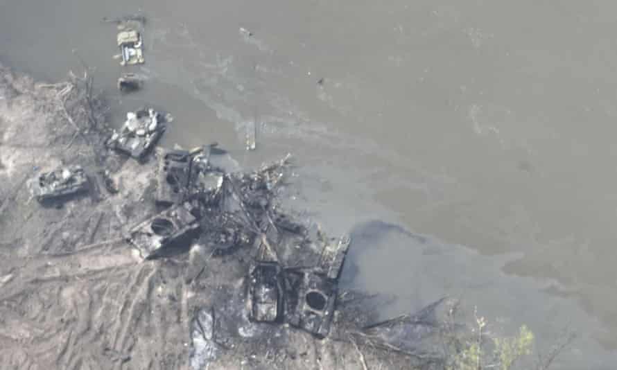 Dozens of destroyed or damaged Russian armored vehicles on both banks of Siverskyi Donets river after their pontoon bridges were blown up in eastern Ukraine.