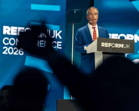 Nigel Farage speaking on stage