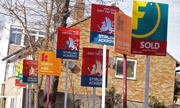 For sale signs outside a house