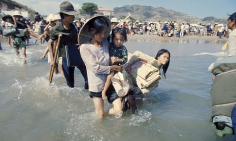 Vietnamese refugees flee Saigon in April 1975