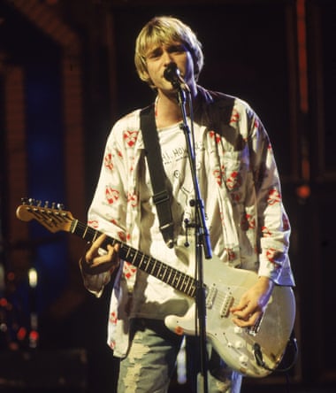 Kurt Cobain performing at the MTV Video Music awards in 1992, wearing his Daniel Johnston T-shirt.