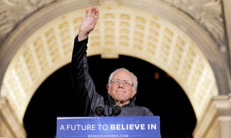 Bernie Sanders salutes the crowd at a campaign rally.