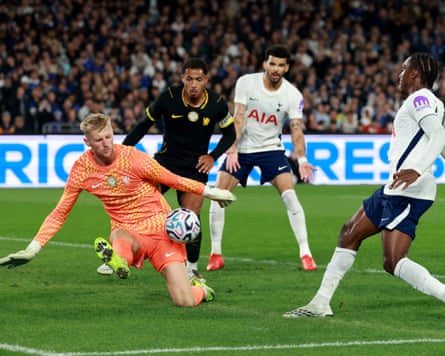 TOPSHOT-FBL-AUS-ENG-CHELSEA-TOTTENHAM-FRIENDLYTOPSHOT - Chelsea's goalkeeper Teddy Sharman-Lowe (L) blocks a shot from Tottenham Hotspur's Mathys Tel (R) during the Sydney Super Cup football match between English Premier League teams Chelsea and Tottenham Hotspur at Stadium Australia in Sydney on August 1, 2026. (Photo by DAVID GRAY / AFP via Getty Images) / --IMAGE RESTRICTED TO EDITORIAL USE - STRICTLY NO COMMERCIAL USE--
