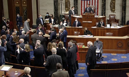 Democrats celebrate on the House floor approving the $1tr package.