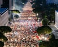 Thousands of people filling a wide street