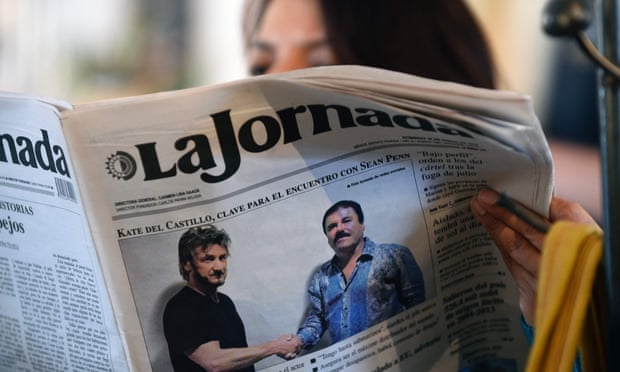A woman reads Mexico City's La Jornada newspaper, in 2016, which shows a picture of El Chapo shaking hands with Sean Penn.