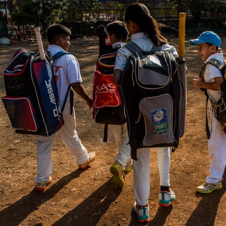 After school, young players arrive at the New Hind ground of the Gymkhana Matunga to take their cricket lesson. They carry bulky bags containing their protective gear and their bats.