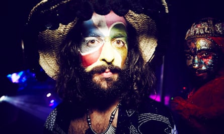 Close up image of a bearded man wearing face paint at the club night Savage. London.