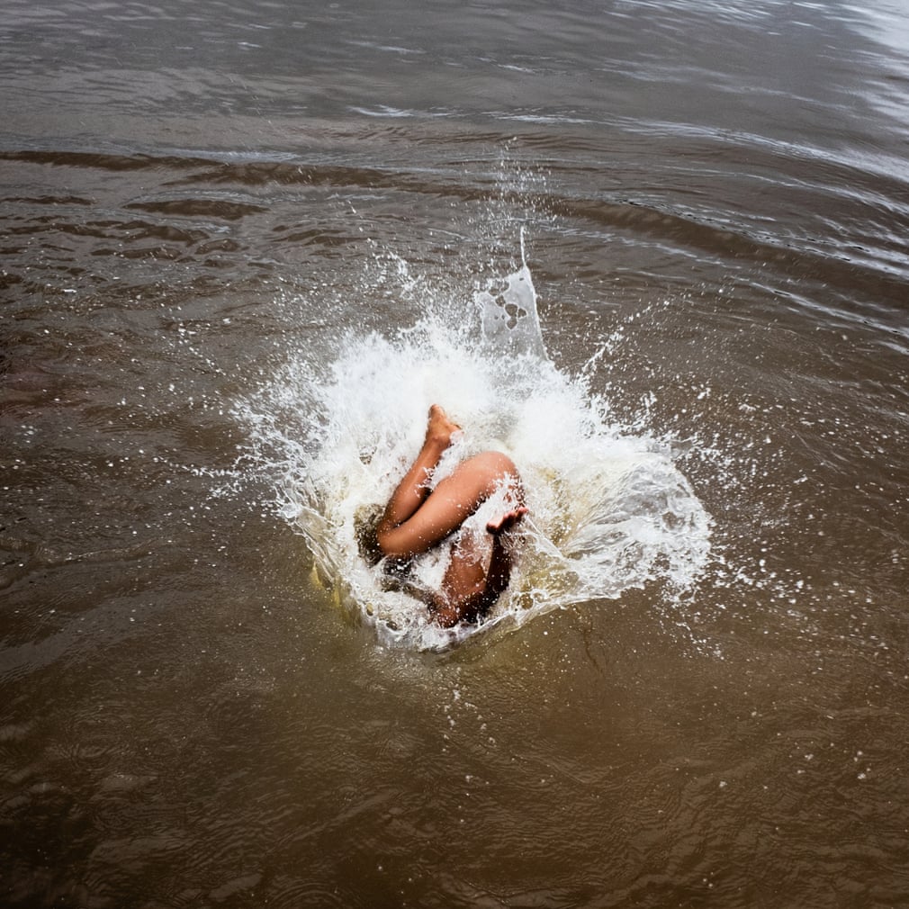 A child from the Xikrin village of “Pot cr” jumps into the Rio Bacaja