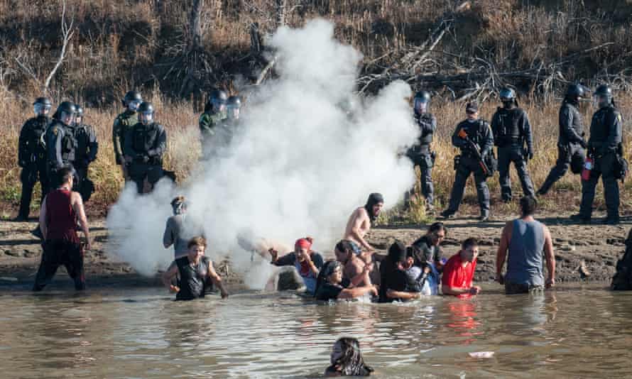 Police officers use tear gas against Water Protectors trying to access Turtle Island on November 2, 2016.