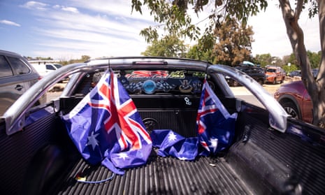 Australian flags are seen tied to the back of a ute on 26 January 2021 in Sydney, Australia
