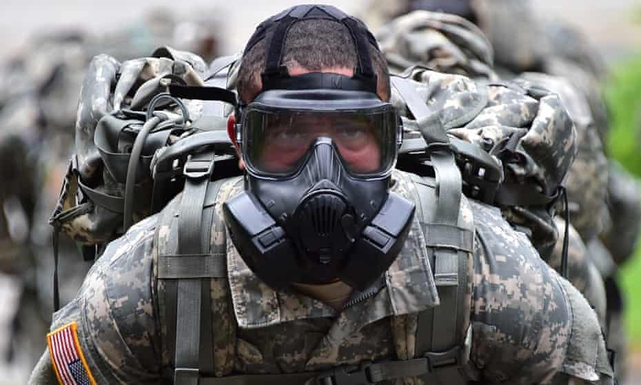 A US soldier wears a gas mask