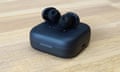 Fairphone Fairbuds review earbuds sitting on top of their charging case.