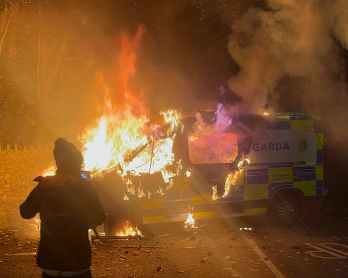 Six arrested after violent protest outside Dublin asylum seeker hotel – video