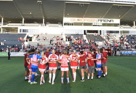 Jonas Eidevall talks to his Arsenal players and staff after their defeat on penalties by Paris FC in the Champions League qualifiers