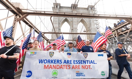 People march across the Brooklyn Bridge during a protest against the Covid-19 vaccination mandates for municipal employees in New York last month.