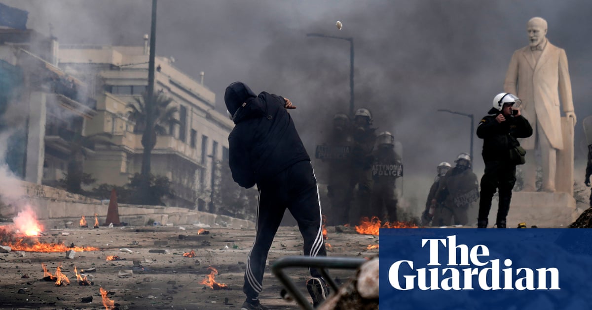 Youths throw rocks at police in Athens as violence erupts amid train crash rally