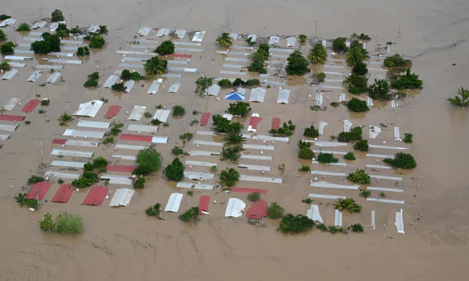 Houses near San Pedro, Honduras, are flooded by Hurricane Iota in 2020. Honduras is one of 11 countries especially vulnerable to climate-related crisis, according to the US national intelligence estimate.