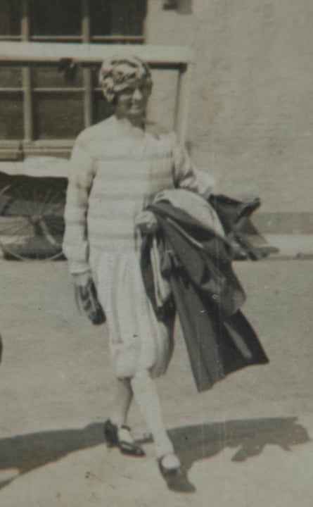 a black and white picture of a woman walking