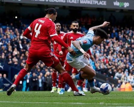 Liverpool’s Virgil van Dijk concedes a penalty against Manchester City’s Nico O’Reilly