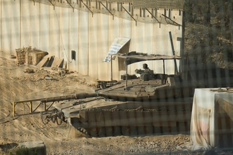 A soldier on a military tank.