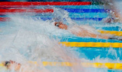 South Africa's Pieter Coetze powers through the water during the men's 50m backstroke final.