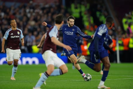 PSG’s Khvicha Kvaratskhelia surges forward during the Champions League quarter-final second leg against Aston Villa.