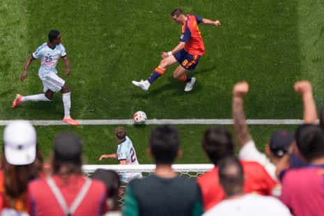 Spain's Fabian Ruiz scores their first goal past Belgium's keeper Thibaut Courtois.