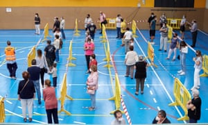 Inhabitants of Sant Joan de les Abadesses in Girona, Spain, wait to be tested for Covid-19 after 34 people in the village became infected last week.