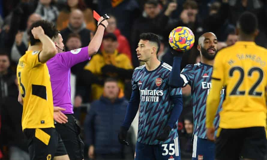 Gabriel Martinelli of Arsenal is shown the red card by Referee Michael Oliver during the Premier League match between Wolverhampton Wanderers and Arsenal.
