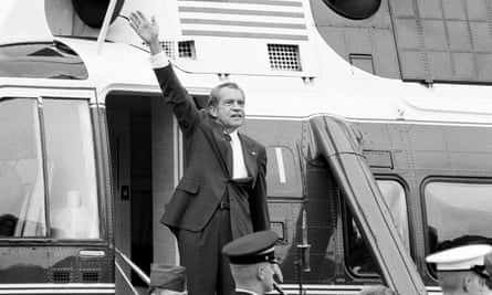 Richard Nixon waves goodbye from the steps of the presidential helicopter after a farewell address to White House staff on 7 August 1974