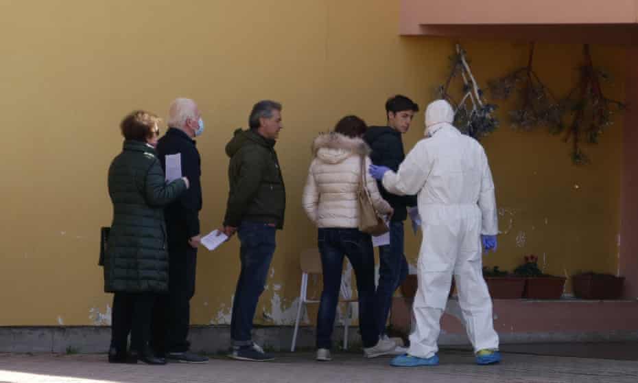 Volunteers line up to undergo testing in Vò, Italy, where the country’s first coronavirus death occurred.