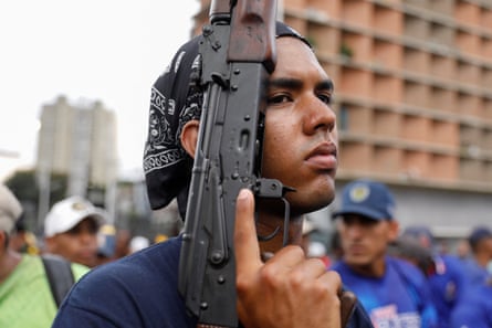 a man holds a rifle