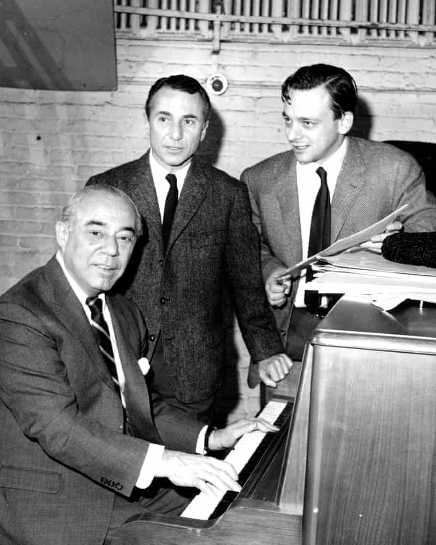 Composer Richard Rodgers, at the piano, lyricist Stephen Sondheim, right, and playwright Arthur Laurents begin work on the musical Do I Hear a Waltz? in New York, 28 December 1964.